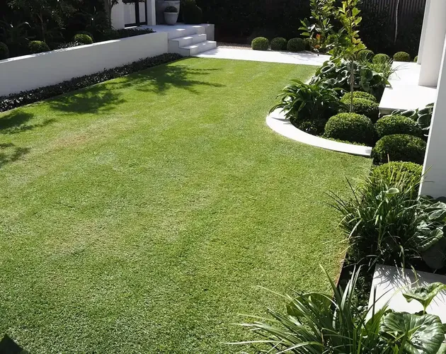 Lawn and clipped shrub border at a Sandwich, IL home