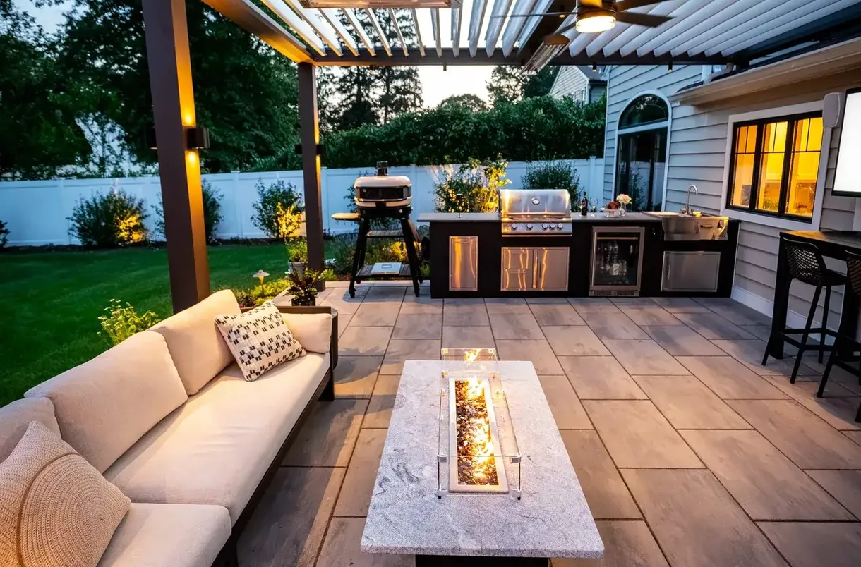 Patio with pergola and outdoor lounge built by Rock Creek Landscape & Hardscape